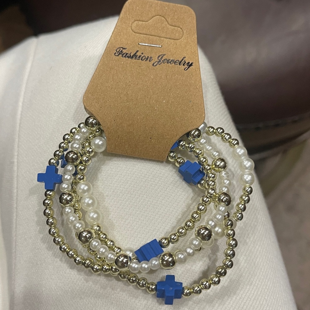 Set of 4 stretch bracelets.gold and navy